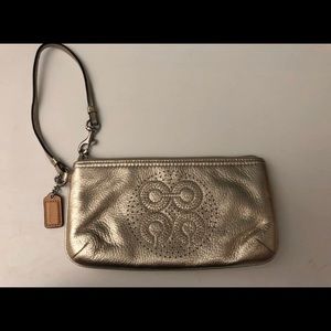 Gold Coach leather wristlet